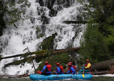 Rafters looking at the Klickitat river Wonder Falls while on the river.